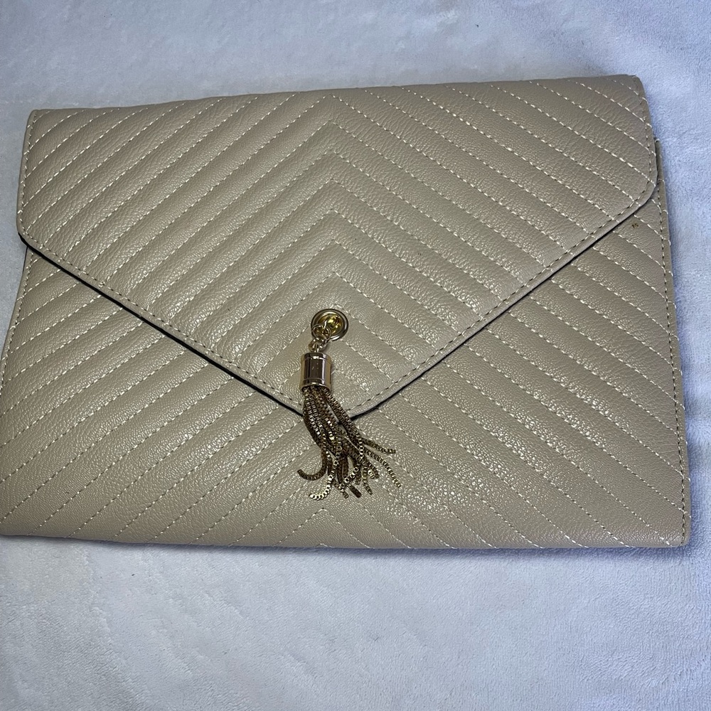 Cream bag with gold shoulder strap
